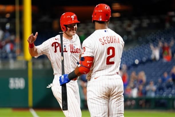 Andrew Knapp and Jean Segura of the Philadelphia Phillies celebrate after the Phillies defeated the Chicago Cubs 6-5 at Citizens Bank Park on...