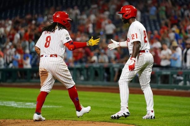 Freddy Galvis of the Philadelphia Phillies celebrates with Andrew McCutchen after hitting a two run home run in the bottom of the fourth inning...