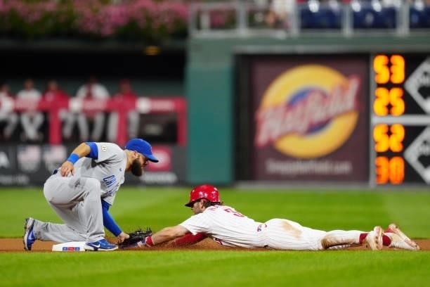 David Bote of the Chicago Cubs tags out Bryce Harper of the Philadelphia Phillies at second base during the game at Citizens Bank Park on Wednesday,...