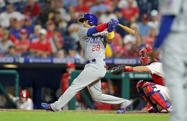 Robinson Chirinos of the Chicago Cubs hits a two-run home run in the eighth inning to tie the score during a game against the Philadelphia Phillies...