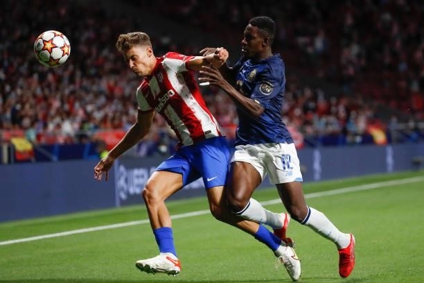 Marcos Llorente of Atletico de Madrid in action with Zaidu of FC Porto during the UEFA Champions League match between Atletico de Madrid and FC Porto...