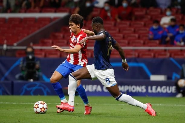Joao Felix of Atletico de Madrid in action with Mbemba of FC Porto during the UEFA Champions League match between Atletico de Madrid and FC Porto at...