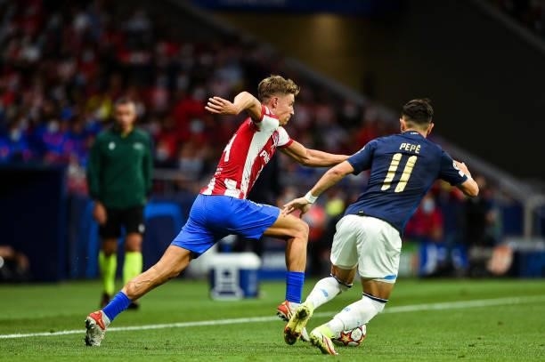 Marcos Llorente and Pepe during UEFA Champions League match between Atletico de Madrid and FC Porto at Wanda Metropolitano on September 15, 2021 in...