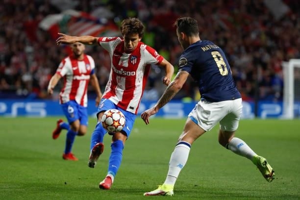 Joao Felix of Atletico de Madrid in action with Mateus Uribe of FC Porto during the UEFA Champions League match between Atletico de Madrid and FC...