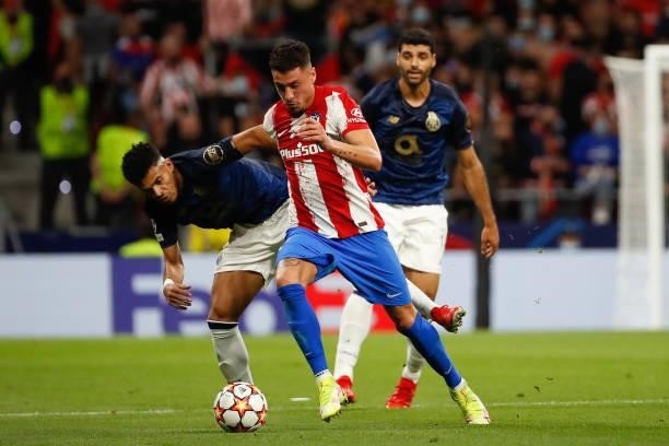 Jose Maria Gimenez of Atletico de Madrid in action with Luis Diaz of FC Porto during the UEFA Champions League match between Atletico de Madrid and...