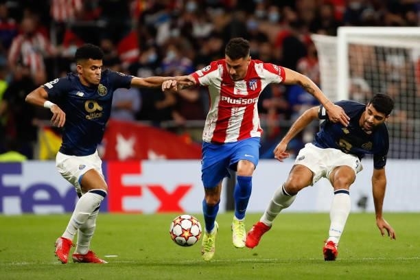 Jose Maria Gimenez of Atletico de Madrid in action with Mehdi Taremi of FC Porto during the UEFA Champions League match between Atletico de Madrid...