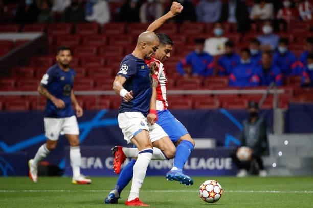 Luis Suarez of Atletico de Madrid in action with Pepe of FC Porto during the UEFA Champions League match between Atletico de Madrid and FC Porto at...
