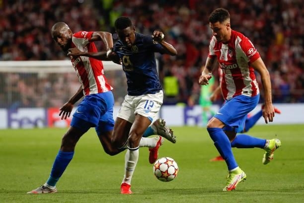 Zaidu of FC Porto in action with Kondogbia of Atletico de Madrid during the UEFA Champions League match between Atletico de Madrid and FC Porto at...