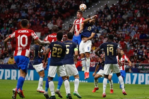 Jose Maria Gimenez of Atletico de Madrid in action with Marko Grujic of FC Porto during the UEFA Champions League match between Atletico de Madrid...