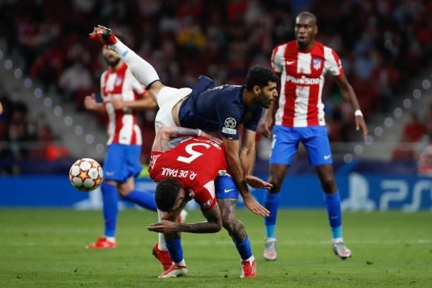 Rodrigo de Paul of Atletico de Madrid in action with Mehdi Taremi of FC Porto during the UEFA Champions League match between Atletico de Madrid and...