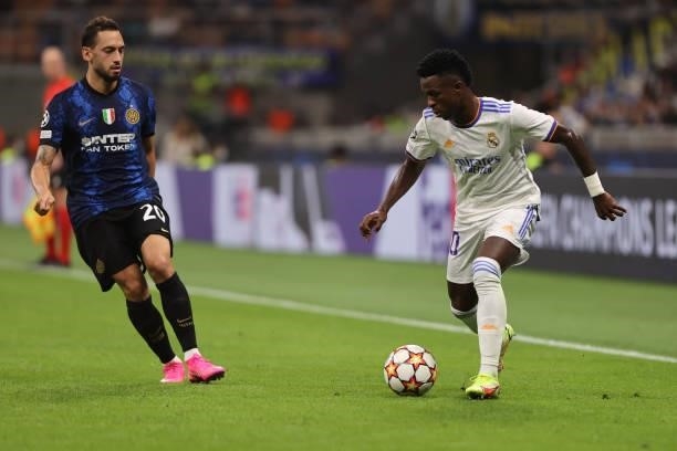 Vinicius Junior of Real Madrid CF in action with Hakan Calhanoglu of FC Internazionale during the UEFA Champions League 2021/22 Group Stage - Group D...