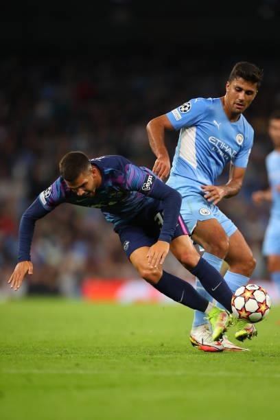 Andre Silva of RB Leipzig is tackled by Rodri of Manchester City during the UEFA Champions League group A match between Manchester City and RB...