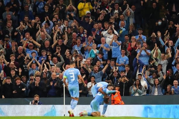 Fans of Manchester City celebrate as Jack Grealish of Manchester City celebrates after scoring a goal to make it 4-2 during the UEFA Champions League...