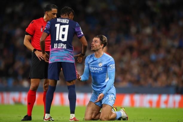 Christopher Nkunku of RB Leipzig talks to Jack Grealish of Manchester City during the UEFA Champions League group A match between Manchester City and...