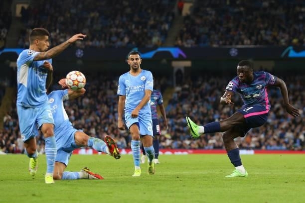 Dominik Szoboszlai of RB Leipzig has a shot blocked by Ruben Dias of Manchester City during the UEFA Champions League group A match between...