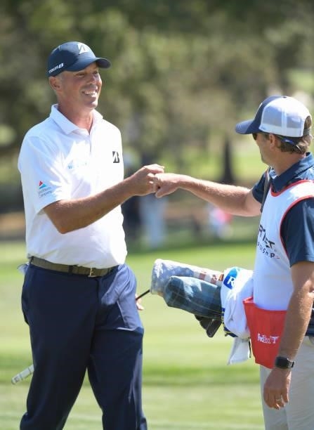 Matt Kuchar bumps fist with his caddie on the third hole during the first round of the Fortinet Championship at Silverado Resort and Spa North on...