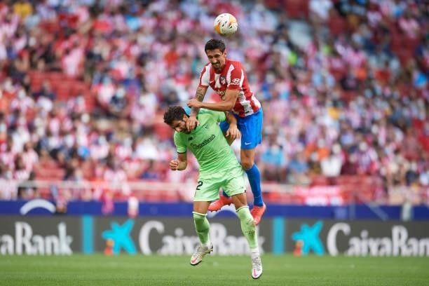 Stefan Savic of Atletico Madrid and Raul Garcia of Athletic battle for the ball during the La Liga Santander match between Club Atletico de Madrid...