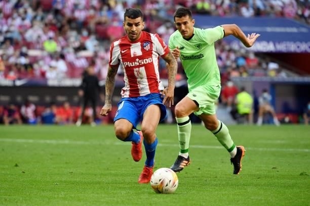 Atletico Madrid's Argentine forward Angel Correa vies with Athletic Bilbao's Spanish defender Dani Vivian during the Spanish League football match...