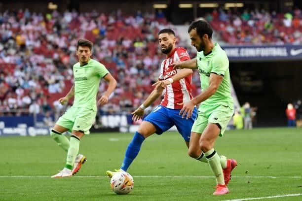 Atletico Madrid's Belgian midfielder Yannick Ferreira-Carrasco vies with Athletic Bilbao's Spanish defender Inigo Lekue during the Spanish League...