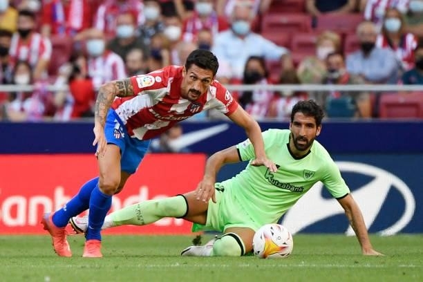 Atletico Madrid's Montenegrin defender Stefan Savic vies with Athletic Bilbao's Spanish midfielder Raul Garcia during the Spanish League football...