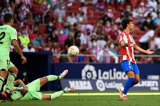 Atletico Madrid's Portuguese midfielder Joao Felix reacts to receiving a red card for fouling Athletic Bilbao's Spanish midfielder Unai Vencedor...