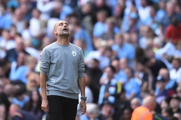 Manchester City's Spanish manager Pep Guardiola reacts after his team is denied a goal following a VAR review during the English Premier League...