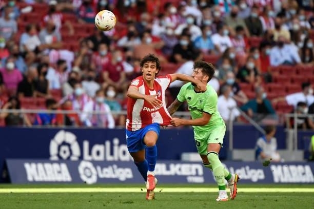 Atletico Madrid's Portuguese midfielder Joao Felix fouls Athletic Bilbao's Spanish midfielder Unai Vencedor during the Spanish League football match...