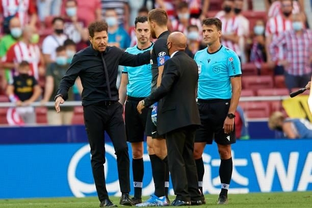 The referee Gil Manzano and Diego Simeone head coach of Atletico Madrid during the La Liga Santander match between Club Atletico de Madrid and...