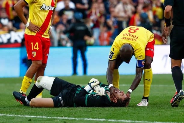 Seko Fofana of RC Lens checks on Jean-Louis Leca of RC Lens during the Ligue 1 Uber Eats match between Lens and Lille at Stade Bollaert-Delelis on...