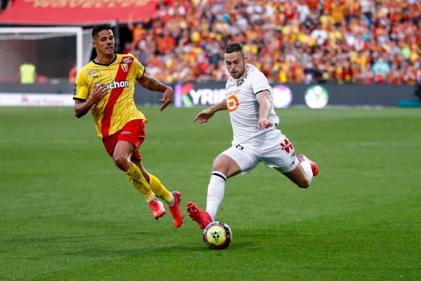 Gabriel Gudmundsson of Lille OSC shoots the ball against Florian Sotoca of RC Lens during the Ligue 1 Uber Eats match between Lens and Lille at Stade...