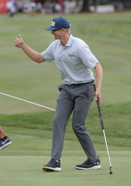 Jim Knous acknowledges the gallery after making a birdie putt on the 18th green during the third round of the Fortinet Championship at Silverado...