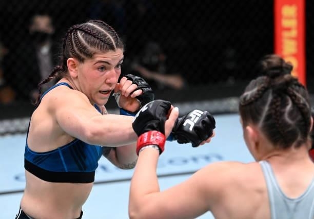 In this handout photo provided by UFC, Sarah Alpar punches Erin Blanchfield in a flyweight fight during the UFC Fight Night event at UFC APEX on...