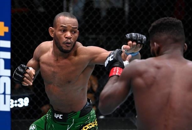 In this handout photo provided by UFC, Carlston Harris of Guyana punches Impa Kasanganay in a welterweight fight during the UFC Fight Night event at...