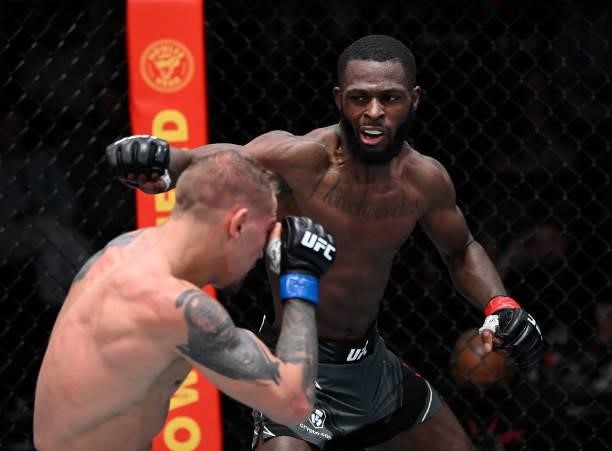 In this handout photo provided by UFC, Montel Jackson punches JP Buys of South Africa in a bantamweight fight during the UFC Fight Night event at UFC...