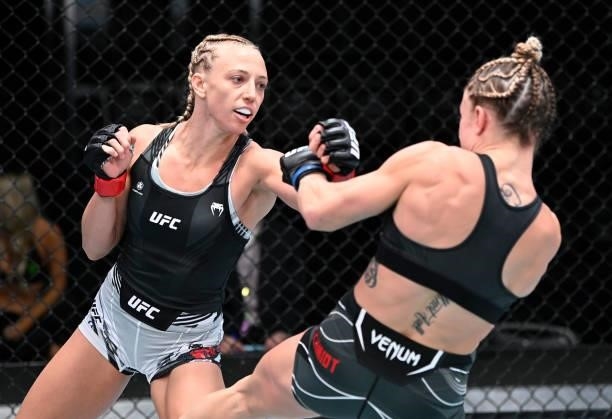 In this handout photo provided by UFC, Emily Whitmire punches Hannah Goldy in a flyweight fight during the UFC Fight Night event at UFC APEX on...