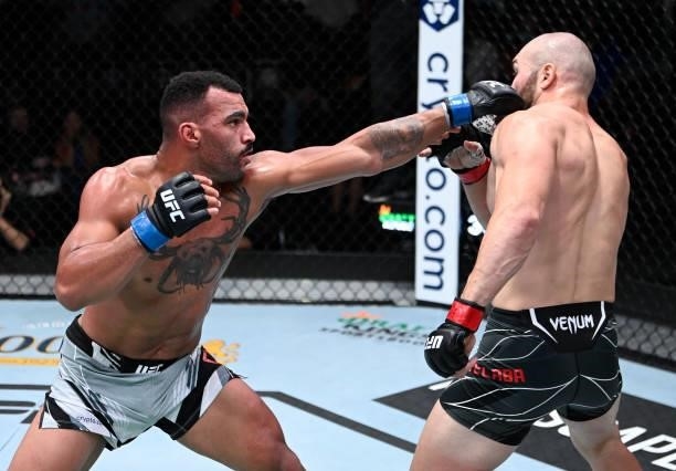 In this handout photo provided by UFC, Devin Clark punches Ion Cutelaba of Moldova in a light heavyweight fight during the UFC Fight Night event at...