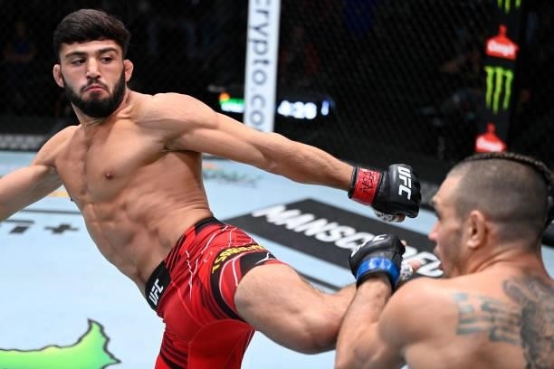 In this handout photo provided by UFC, Arman Tsarukyan of Armenia kicks Christos Giagos in a lightweight fight during the UFC Fight Night event at...