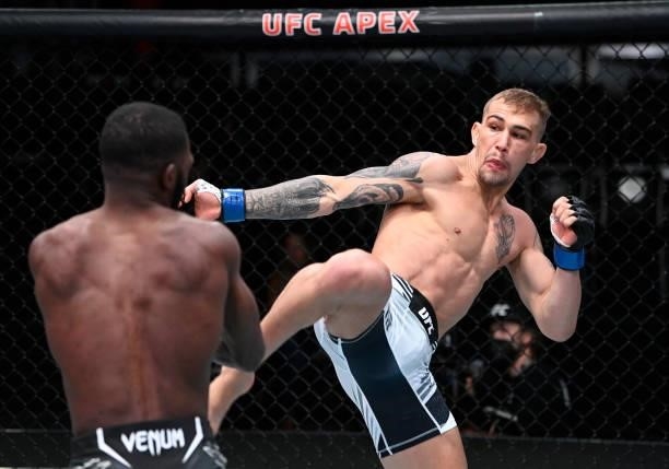 In this handout photo provided by UFC, JP Buys of South Africa kicks Montel Jackson in a bantamweight fight during the UFC Fight Night event at UFC...