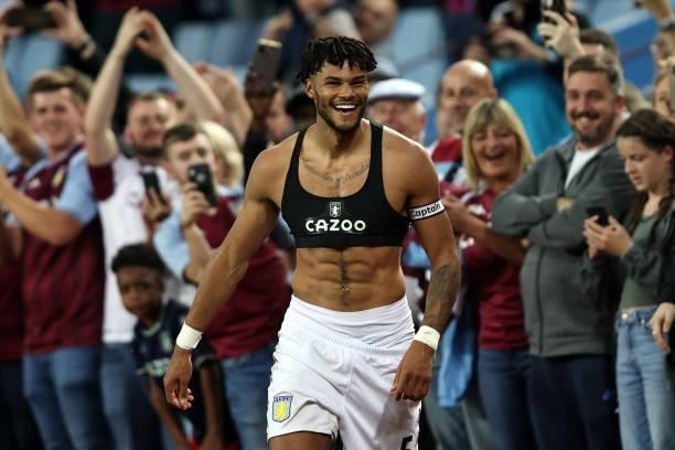 Tyrone Mings of Aston Villa reacts after giving his shirt to a fan during the Premier League match between Aston Villa and Everton at Villa Park on...