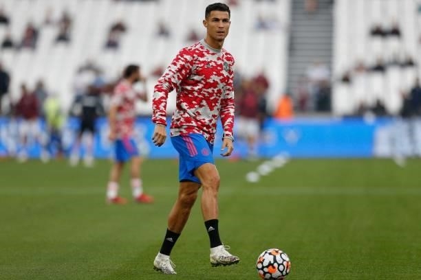 Manchester United's Portuguese striker Cristiano Ronaldo warms up ahead of the English Premier League football match between West Ham United and...