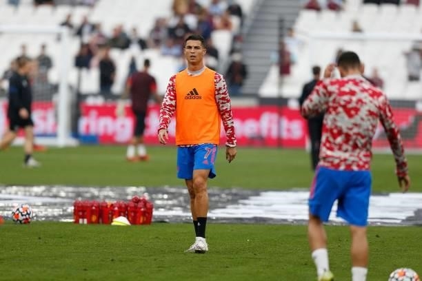 Manchester United's Portuguese striker Cristiano Ronaldo warms up ahead of the English Premier League football match between West Ham United and...