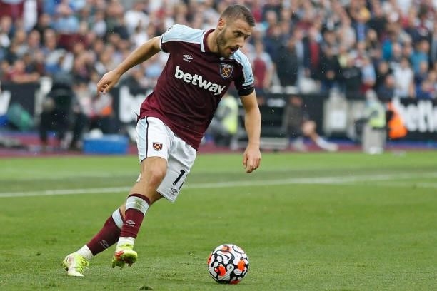 West Ham United's Coatian midfielder Nikola Vlasic runs with the ball during the English Premier League football match between West Ham United and...