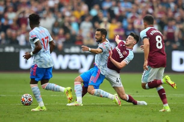 Bruno Fernandes of Manchester United under pressure from Declan Rice of West Ham United during the Premier League match between West Ham United and...