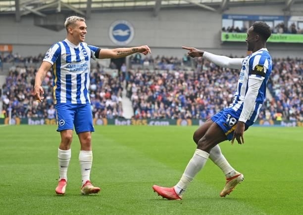 Brighton's English striker Danny Welbeck celebrates scoring his team's second goal with Brighton's Belgian midfielder Leandro Trossard during the...