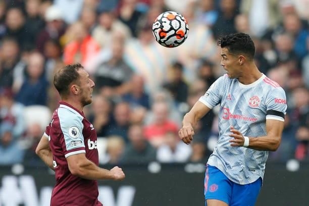 Manchester United's Portuguese striker Cristiano Ronaldo vies with West Ham United's Czech defender Vladimir Coufal during the English Premier League...