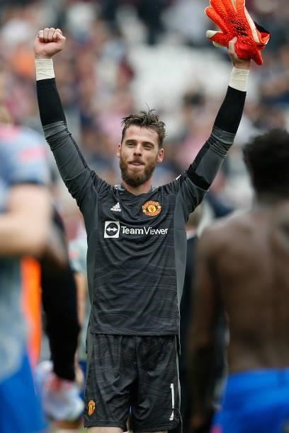 Manchester United's Spanish goalkeeper David de Gea celebrates on the pitch after the English Premier League football match between West Ham United...