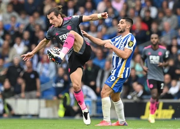 Leicester City's Turkish defender Caglar Soyuncu and Brighton's French striker Neal Maupay compete for the ball during the English Premier League...