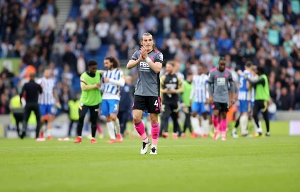 Caglar Soyuncu of Leicester City applauds the travelling Leicester City fans after the Premier League match between Brighton & Hove Albion and...