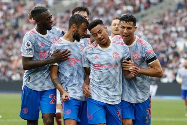 Manchester United's English midfielder Jesse Lingard celebrates with teammates after scoring their second goal during the English Premier League...