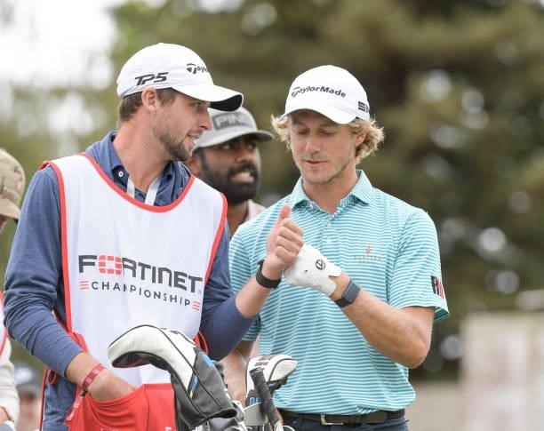 Austin Smotherman bumps fist with caddies on the first hole during the third round of the Fortinet Championship at Silverado Resort and Spa North on...